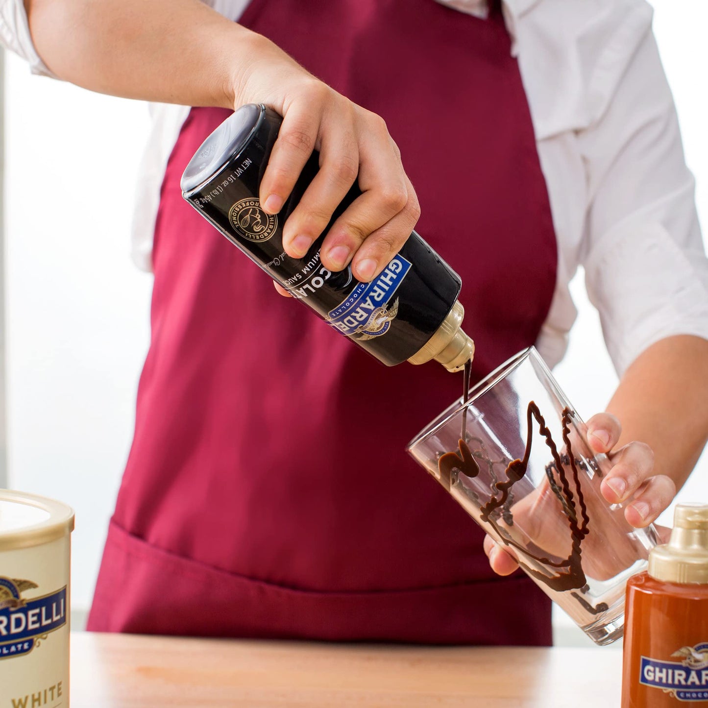 Ghirardelli Sea Salt Caramel and Chocolate Flavored Sauce 16 oz Squeeze Bottles Pack of 2 with Ghirardelli Stamped Barista Spoon